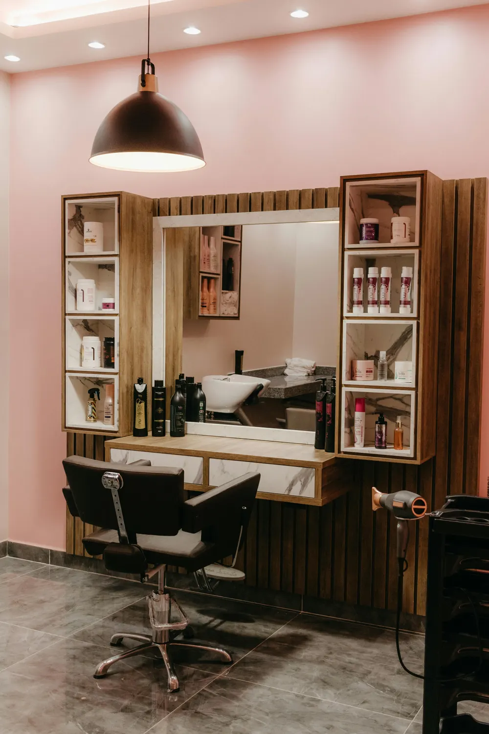 The SalonDemo studio interior — chair, mirror, soft west light